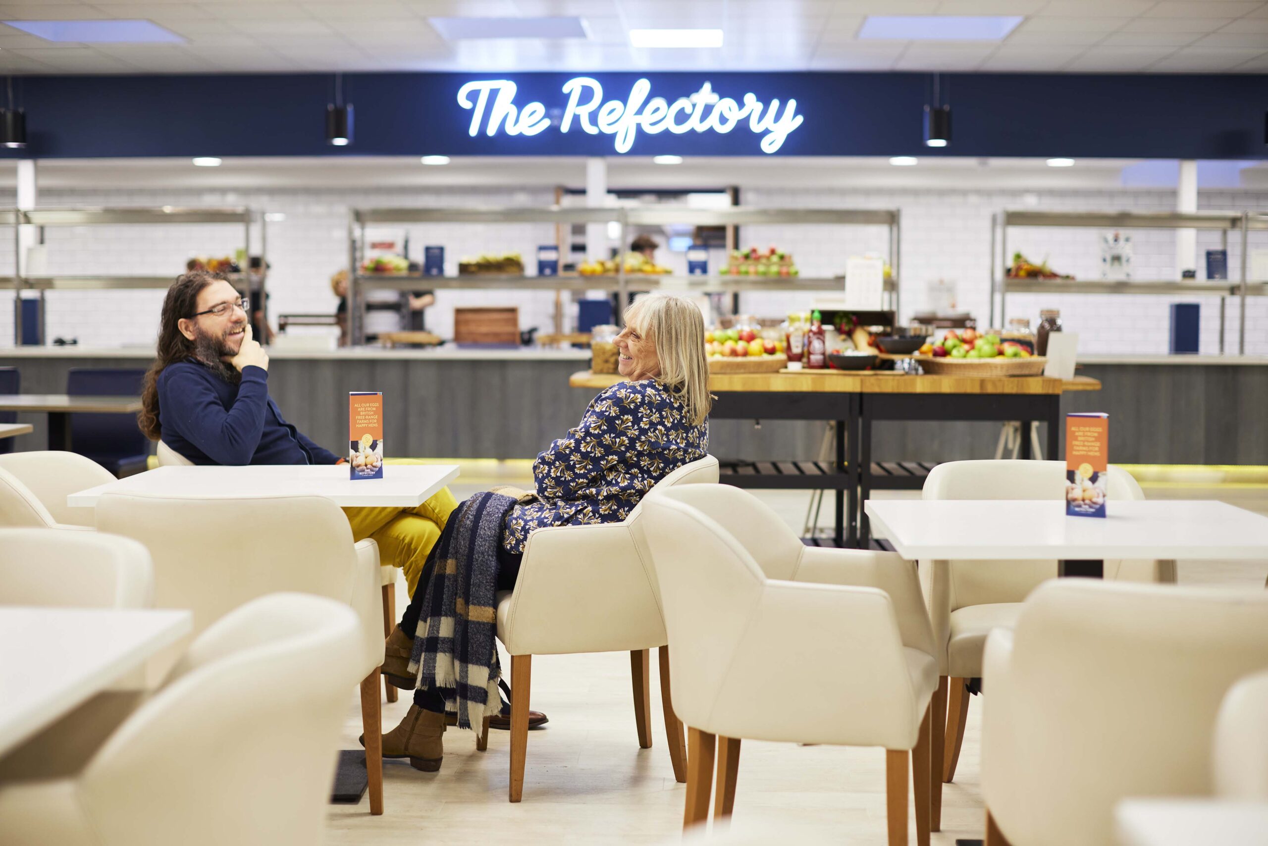 Breakfast and self-service buffet setup in the dining hall at Worth School, illustrating full-board accommodation for Metis Institute training weekends.